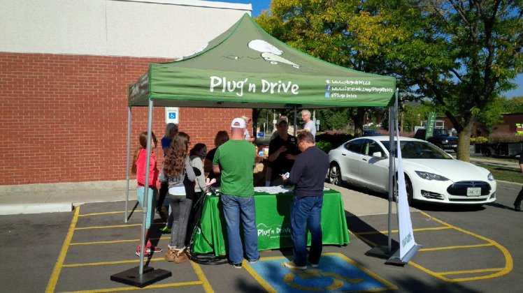 Plug 'n Drive information booth. E-vehicles were available for test drives.
