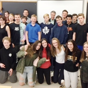 Mr. Papadopoulos, Grade 9 geography students and guests pose for a photo.